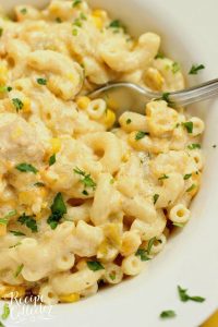 Green Chile Chicken Mac & Cheese - This hearty all-in-one macaroni and cheese dinner idea is filled with chicken, green chiles, corn, and of course all the creamy cheese!