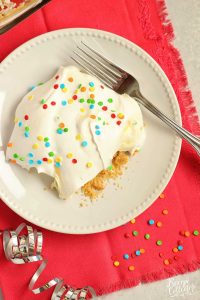 No-Bake Birthday Yummy - Layers of cream cheese pudding and vanilla pudding piled onto a delicious golden oreo cookie crust!