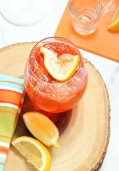 This Aperol Rose is a mix of aperol, lemon vodka, sparkling rose, honey and lemon. It's a great summer drink recipe!
