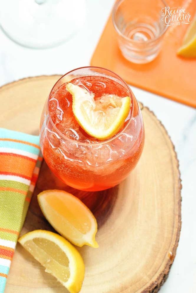 This Aperol Rose is a mix of aperol, lemon vodka, sparkling rose, honey and lemon. It's a great summer drink recipe!