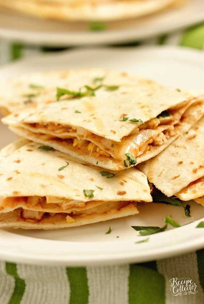 These Barbecue Chicken Quesadillas are triple-stacked with chicken, shredded cheese, grilled corn, thinly sliced onions, cilantro, and barbecue sauce.  They make a fun grilling recipe!!