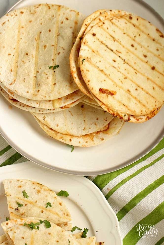 These Barbecue Chicken Quesadillas are triple-stacked with chicken, shredded cheese, grilled corn, thinly sliced onions, cilantro, and barbecue sauce.  They make a fun grilling recipe!!