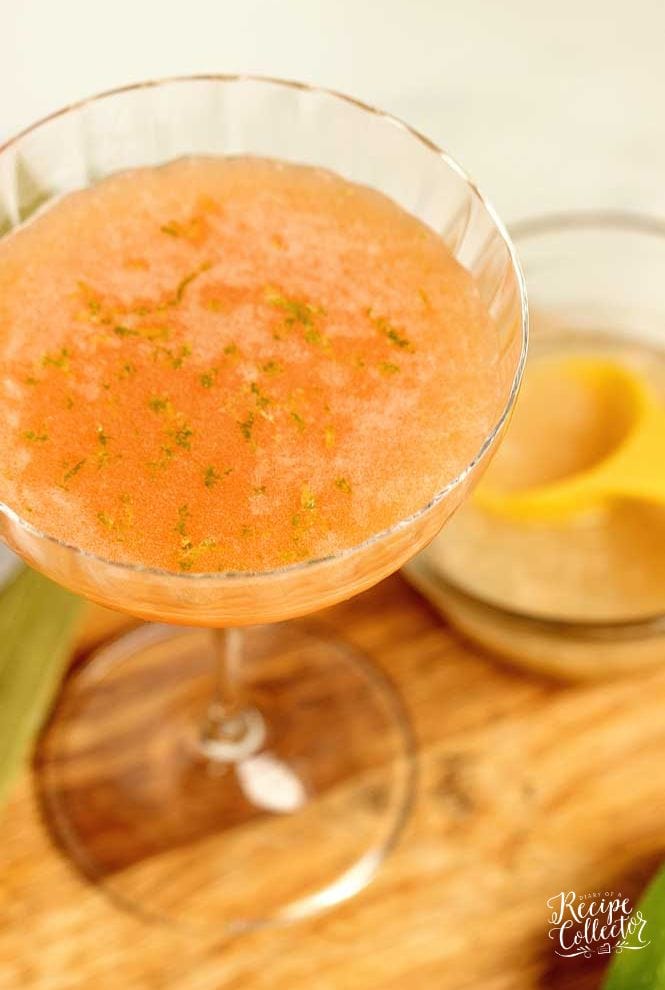 Pink Sunrise Cocktail - A lovely blend of vodka, aperol, Coco Lopez, pineapple juice, and lime zest! It's a perfect summer drink!