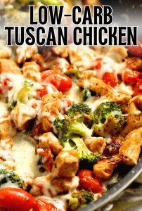 Low-Carb Tuscan Chicken - An easy low-carb healthy one pan dish filled with chicken breasts, broccoli, grape tomatoes, sun-dried tomatoes, spices, and a creamy light sauce and topped with cheese. It's great for meal prep too!